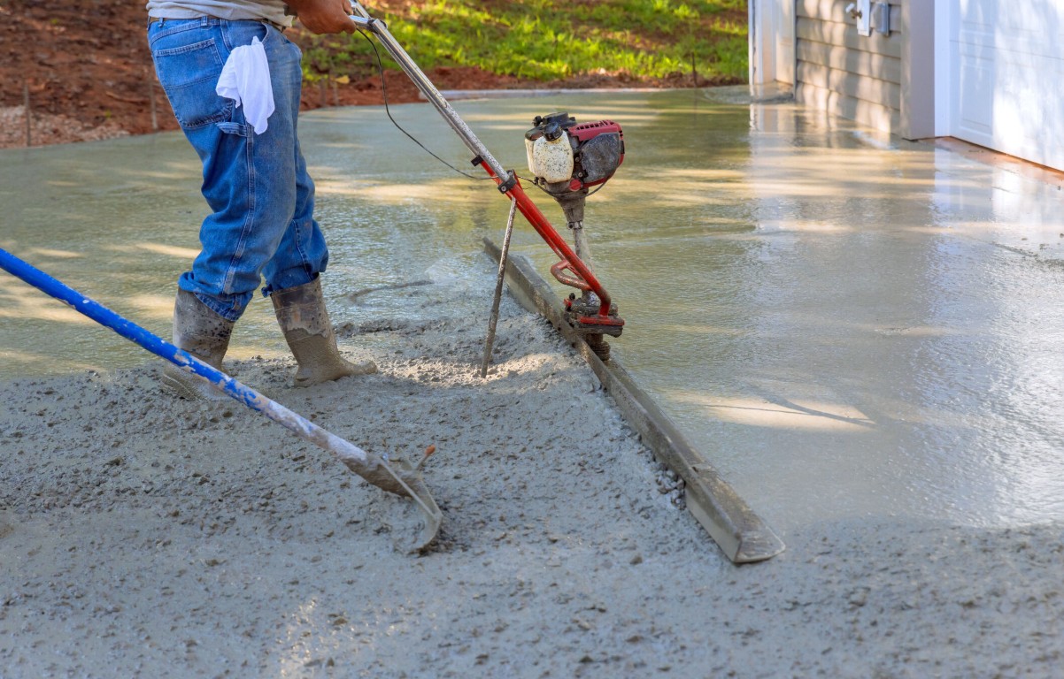 Professional concrete finishing work using specialized equipment